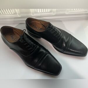 Gently used men’s black dress shoes.